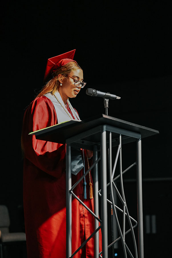 Kleshea Douglas giving a speech at her high school graduation ceremony