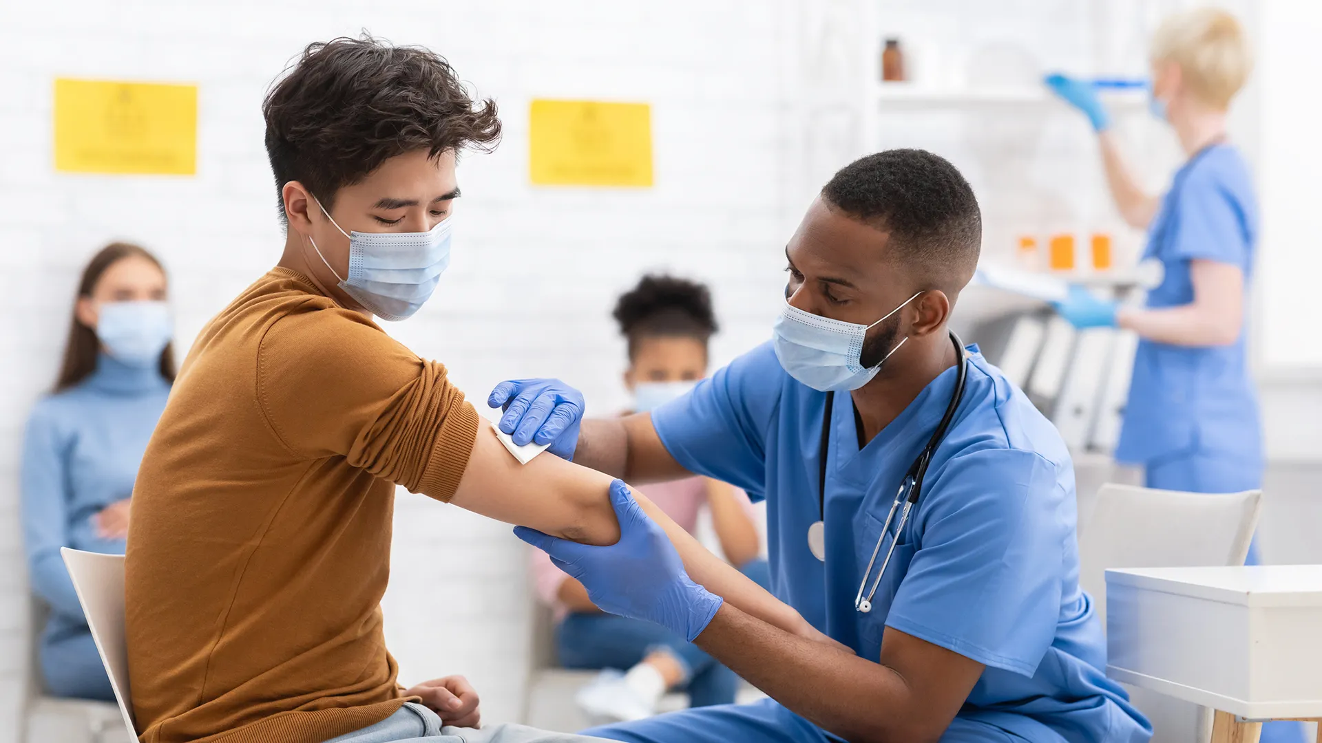 Asian Male Patient Getting Vaccinated Against Coronavirus Receiving Covid Vaccine