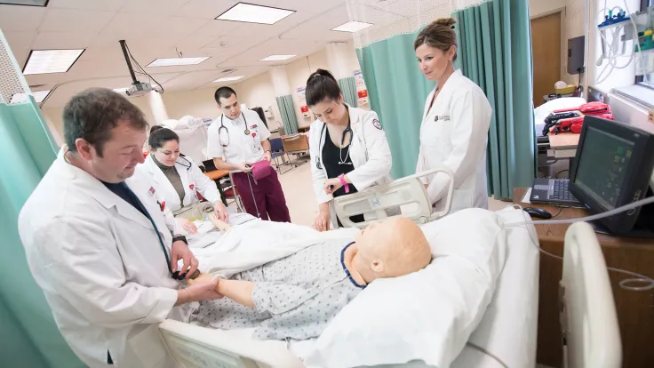 Group of nursing students in Germanna's virtual hospital with simulated patient