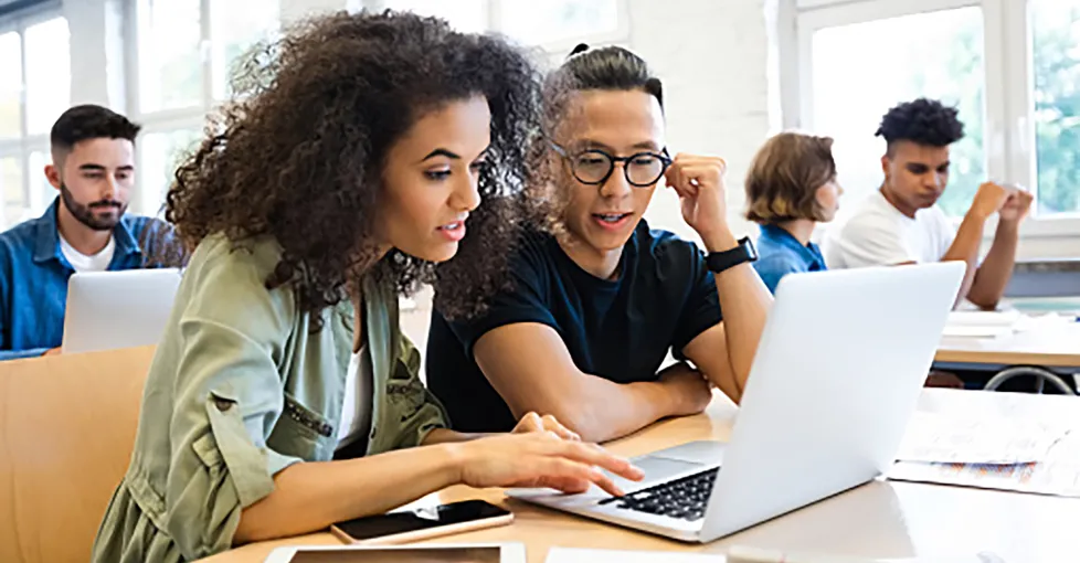 Two Young College Students Working Together on a Laptop in Their College ClassroomGeneral Studies - Associate of Arts & Sciences Program